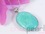 green oval turquoise pendant with a green jade