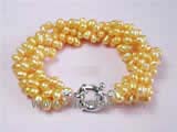 5-6mm yellow top drilled freshwater pearl twisted bracelet  with a silver plated spring ring clasp