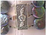 three rows 14mm black coin freshwater pearl necklace with a sterling silver box clasp