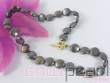 12mm black coin freshwater pearl necklace with a plated gold fish clasp