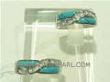 X shape 925 silver ring with turquoise ornament on it
